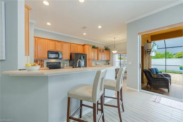 Check out this kitchen - It has an eat-in area facing the pool.