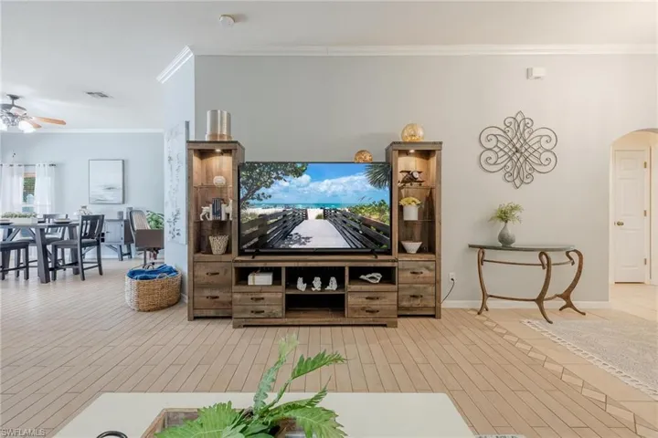 Expansive living room opens to roomy dining area and entertainment style kitchen.