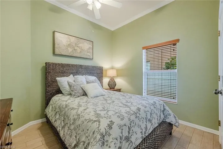 Bedroom 3. Tile floors and crown molding throughout the home.