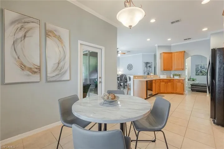 Eat-in kitchen area has direct access to the covered lanai.