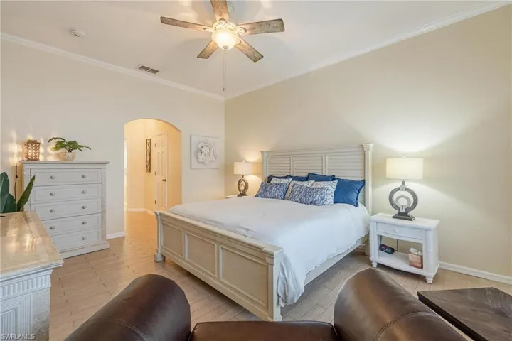Primary Bedroom - private from main living space. Hallway has a walk-in closet on either side and leads to primary bath.