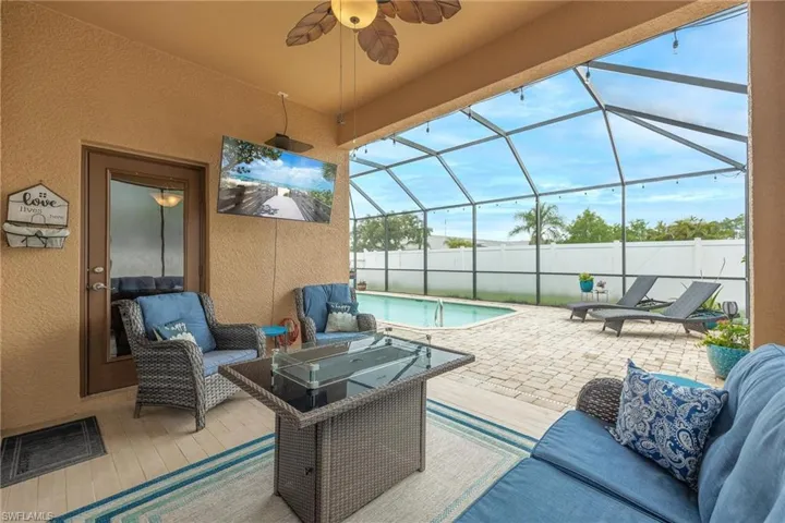 Enjoy protected - covered outdoor space AND a screened cage over a large rectangle shaped pool.