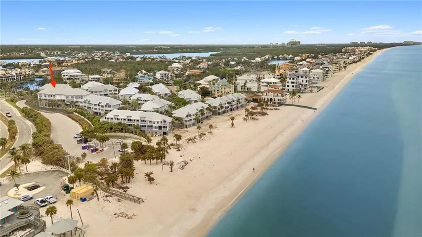 Birds eye view of property featuring Gulf view and a view of the beach