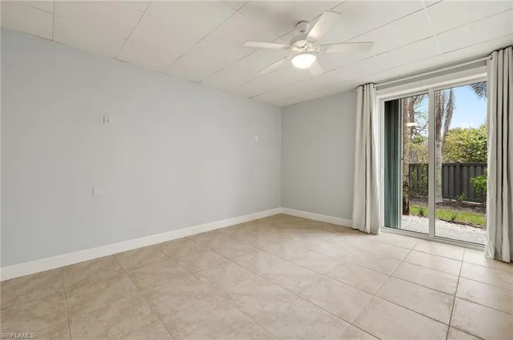 4th bedroom with ceiling fan and light tile patterned flooring