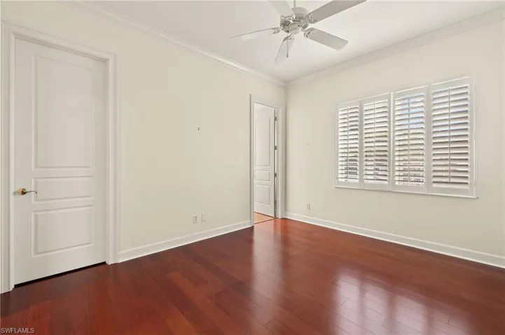 2nd  Bedroom with ceiling fan, dark hardwood / wood floors, and crown molding