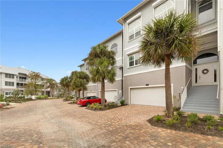View of property with double garage