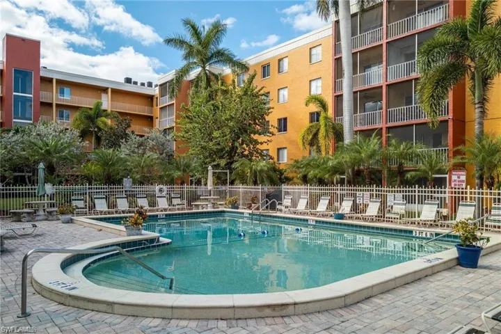 Pool featuring a patio and fence