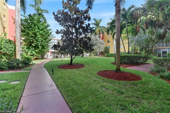 View of community featuring a lawn