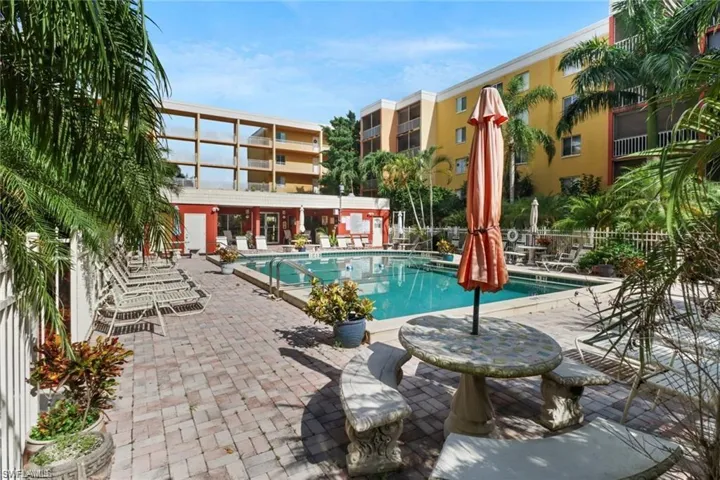 Community pool with a patio area