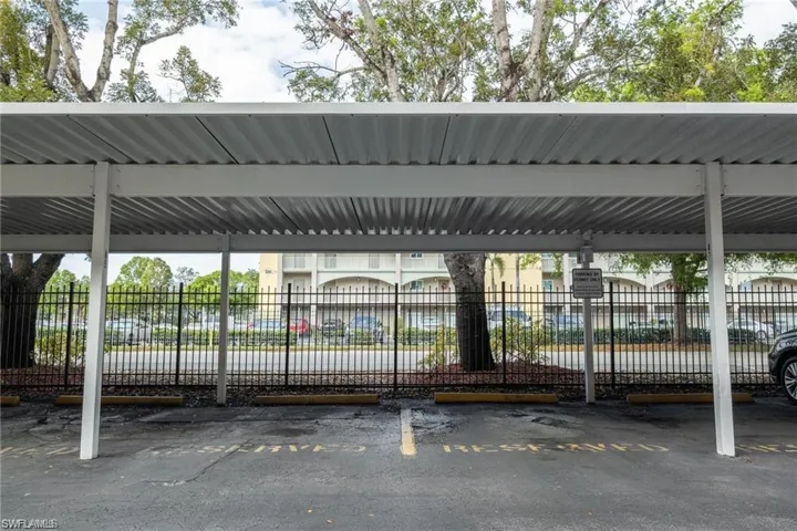 Covered parking lot with fence