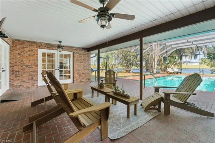 Poolside covered seating with breathtaking views of the tranquil river