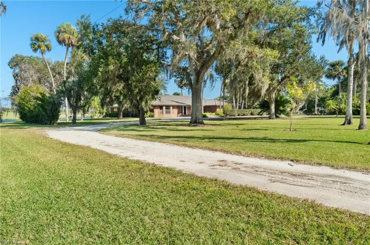 Single-story home set on nearly 3 acres, offering the perfect canvas to create your own dream space