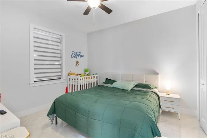 Bedroom with a closet and a ceiling fan