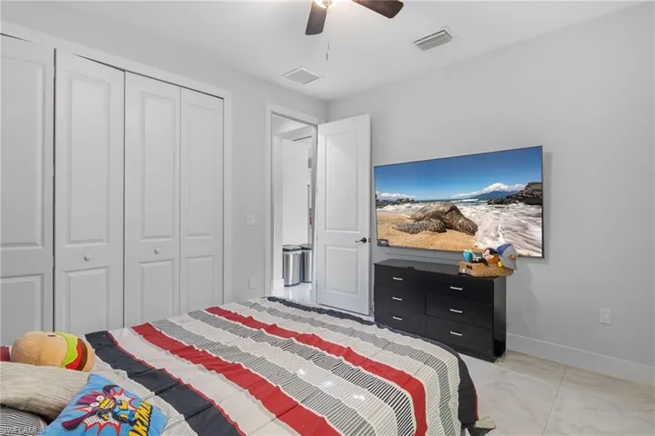 Bedroom with a closet and a ceiling fan