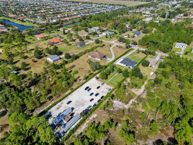 Aerial view of property's location featuring a nearby body of water