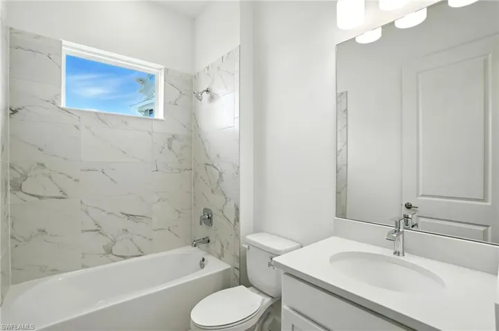 Full bathroom featuring shower / bathtub combination and vanity