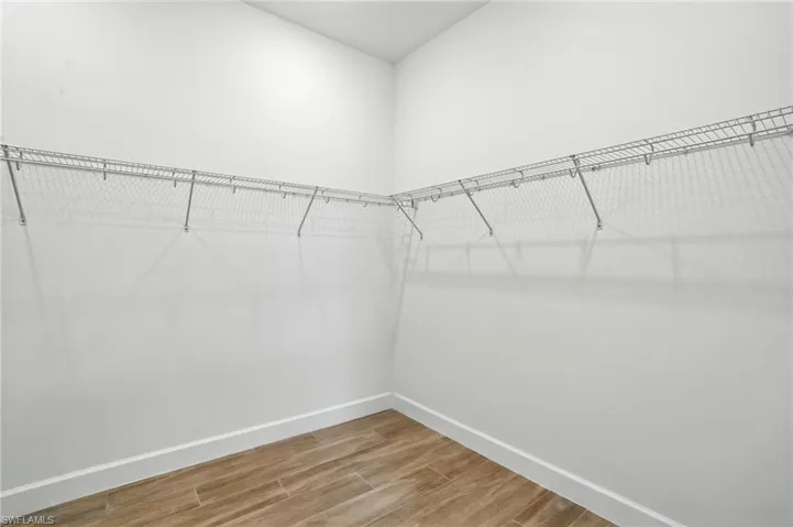 Walk in closet featuring light wood finished floors