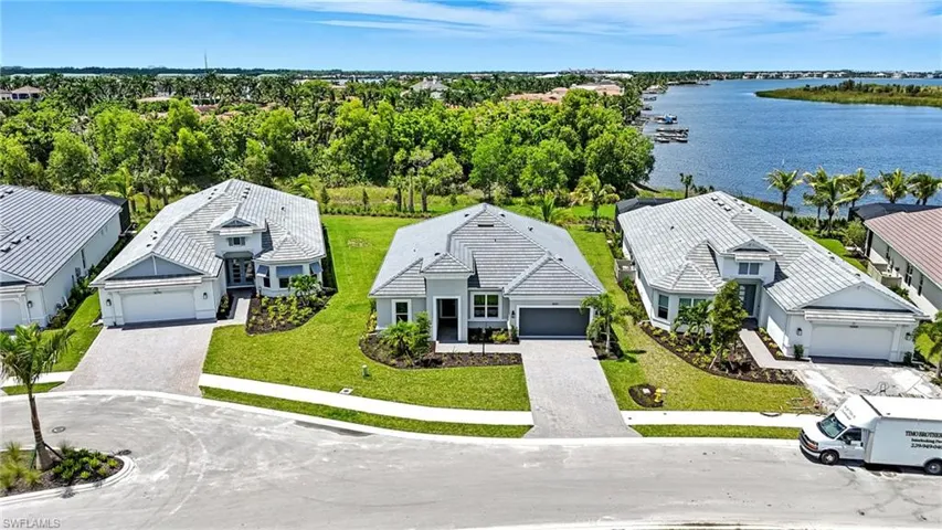 Aerial view of residential area with a large body of water