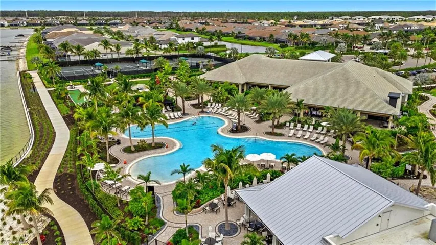Community pool featuring a residential view and a patio