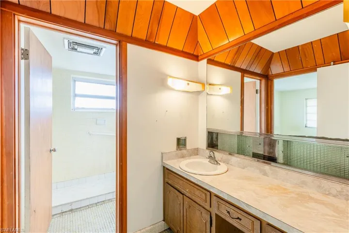 Bathroom with tile patterned flooring and vanity
