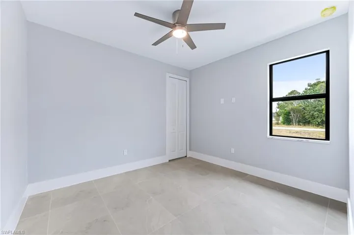 Unfurnished room with ceiling fan