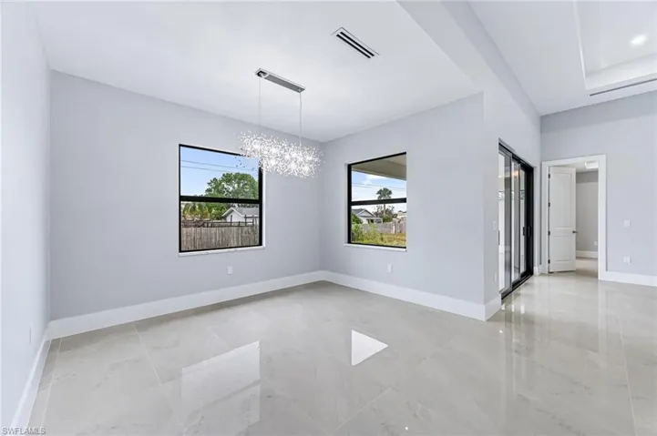 Empty room featuring a notable chandelier