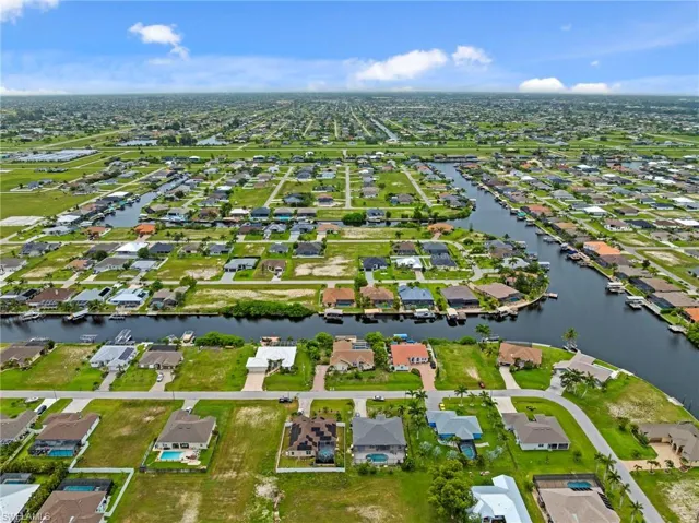 Aerial view of property and surrounding area featuring easy access to the gulf