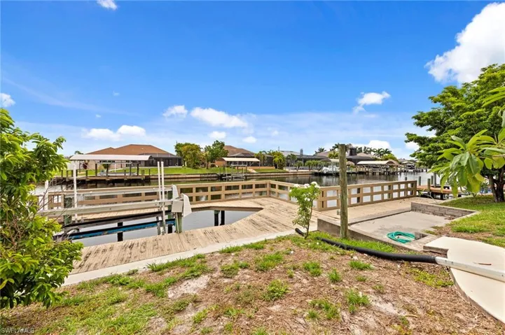 Dock featuring a water view and a residential view