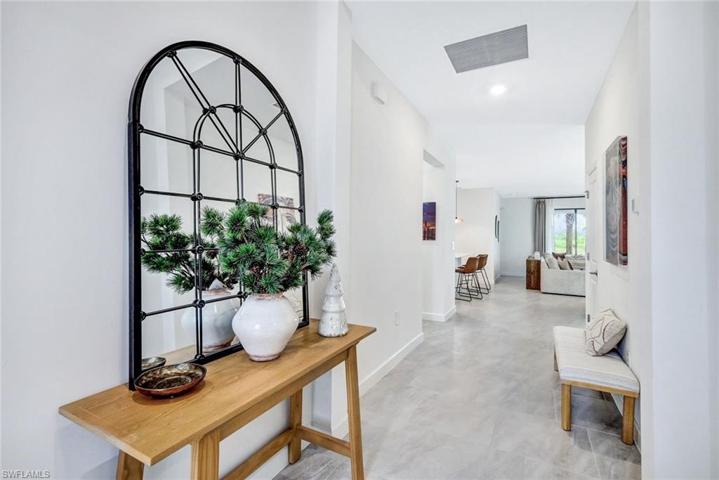 Entry foyer, glass door lets in the Florida sunshine!