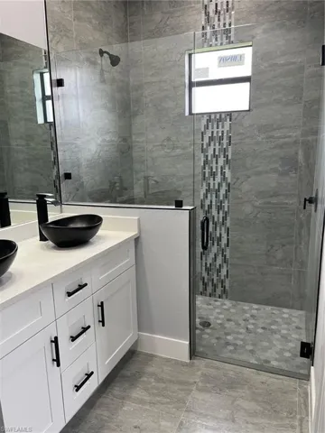 Bathroom featuring vanity and walk in shower