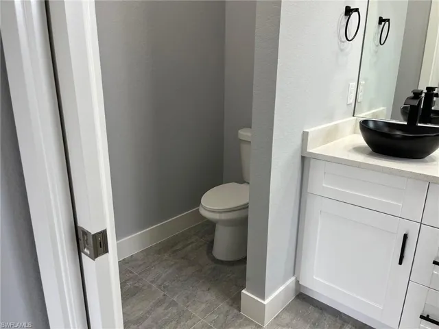 Bathroom with vanity and toilet