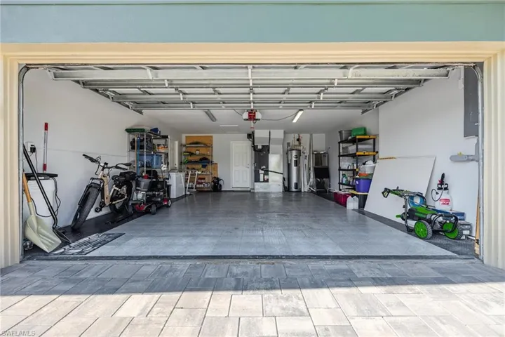 Garage featuring water heater