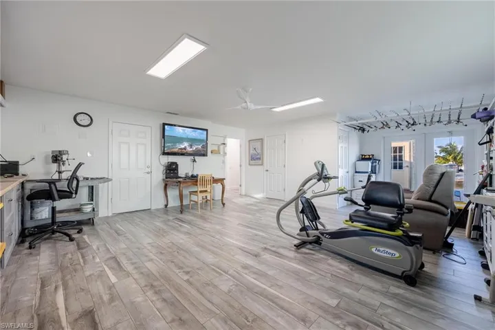 Bonus room with light wood-type laminate flooring
