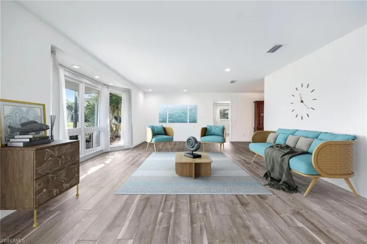 Virtual Photo-Living room with light hardwood / wood-style flooring and a wealth of natural light