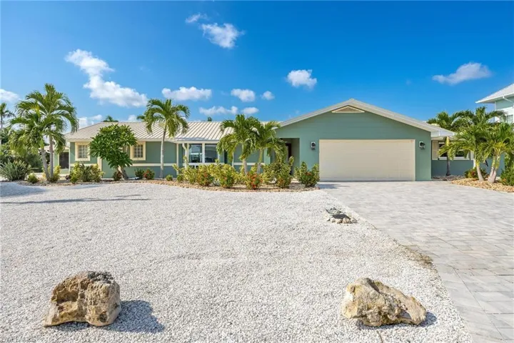 Single story home featuring a garage