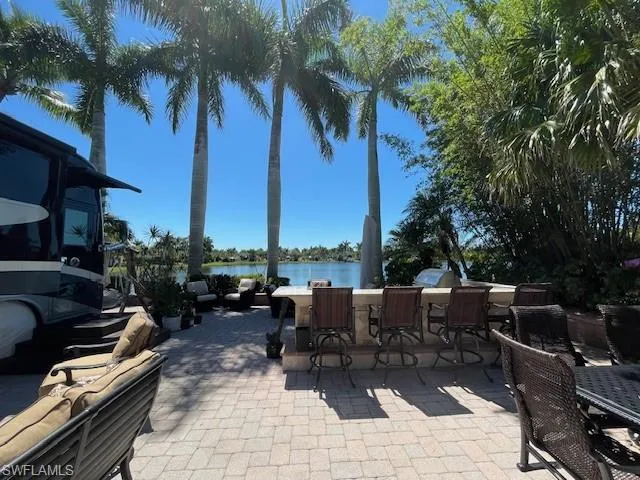 View of patio / terrace featuring a water view
