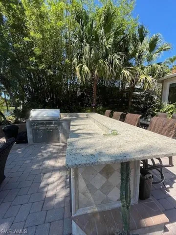 View of patio with an outdoor kitchen