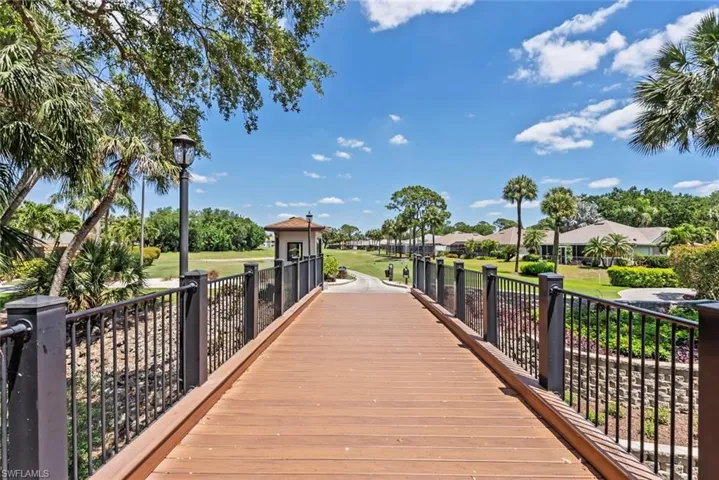 View of property's community featuring a residential view and a lawn