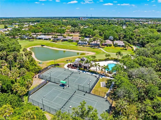 Drone / aerial view with a water view and golf course view