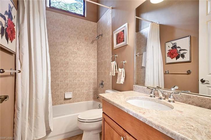 Full bath serves the den and guest room