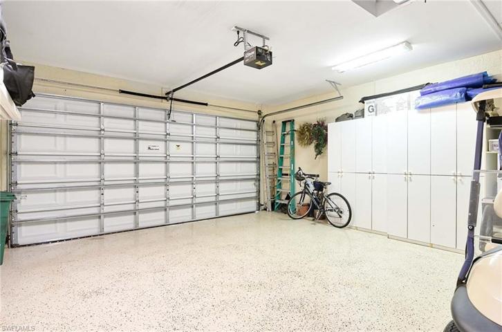 Two car garage with depth to accommodate two cars and a golf cart