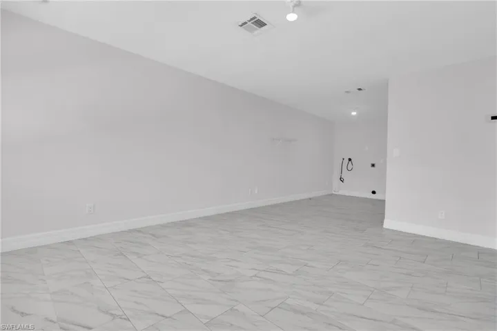Empty room with baseboards and light marble finish flooring