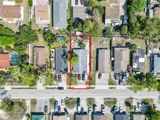 Aerial view of residential area with property boundaries highlighted