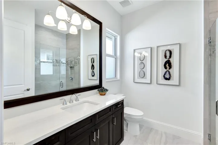 Bathroom with vanity and a shower stall