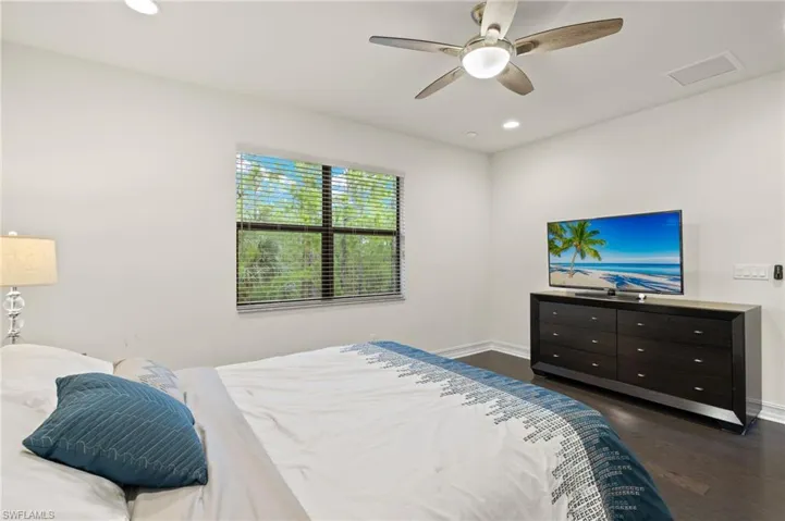 Large Owners Suite featuring dark hardwood flooring