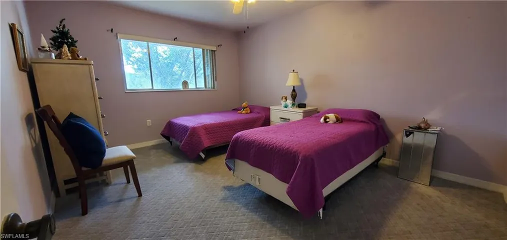 Carpeted bedroom with baseboards