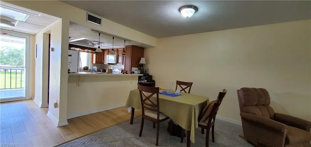 Dining space featuring light wood finished floors and baseboards