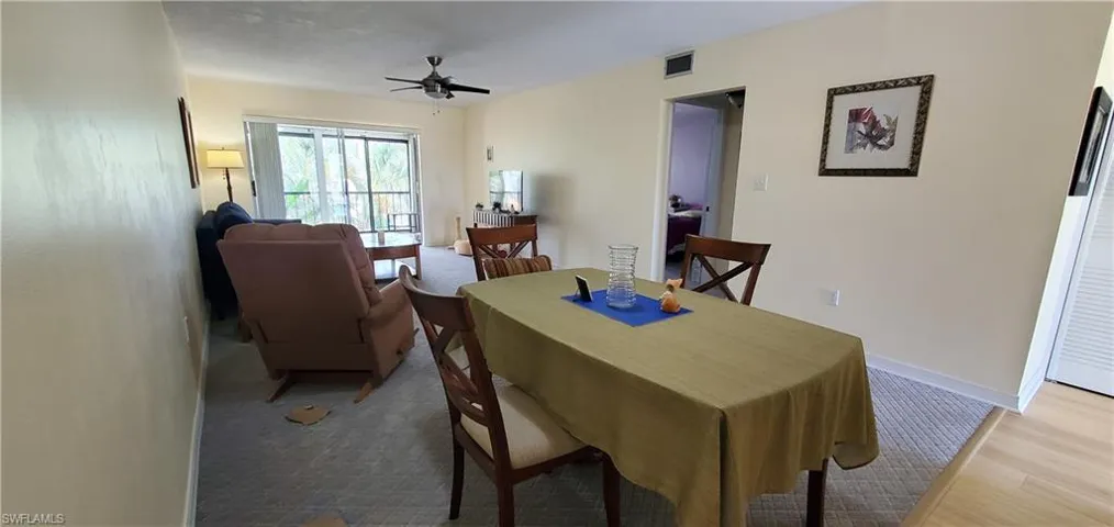 Dining area featuring ceiling fan and baseboards