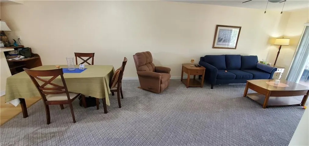 Dining area with carpet and ceiling fan