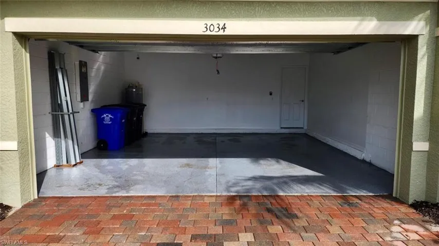 Garage with concrete block wall and water heater